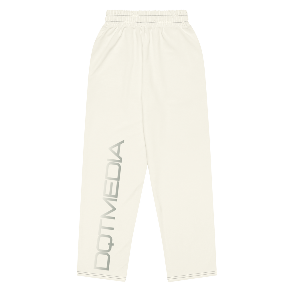 These are stylish cream-colored pants featuring the 'DQTMEDIA' logo elegantly displayed on a matching cream background. The logo is subtly integrated into the design, creating a cohesive, polished look that pairs well with a variety of outfits. Whether you're dressing up for a casual outing or keeping it relaxed at home, these cream pants provide both comfort and a touch of sophistication.