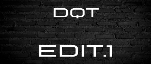 Brick wall with 'DQT' and 'EDIT.1' text in white