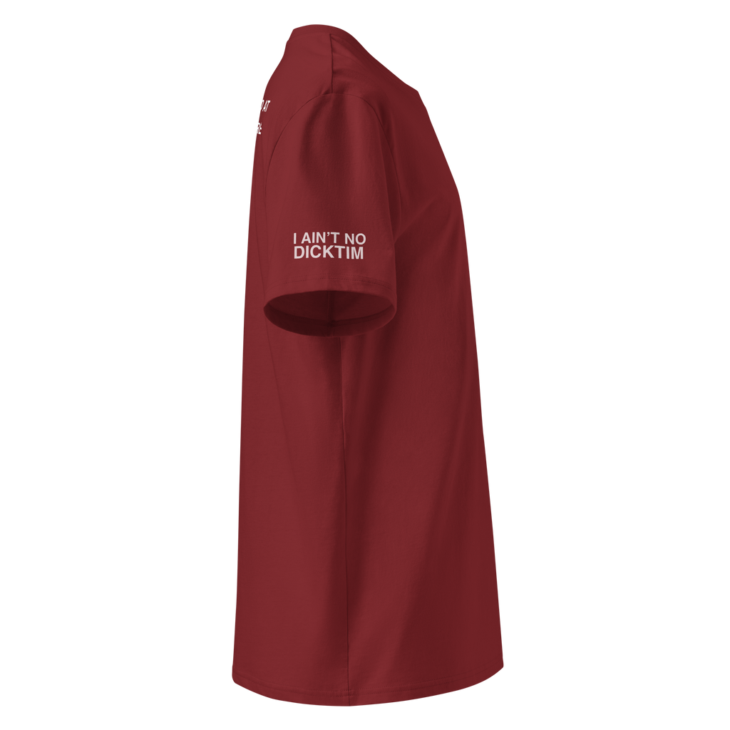 A side-profile view of a short-sleeve crewneck t-shirt in maroon red, featuring the white printed text 'I AIN'T NO DICKTIM' on the left chest, set against a plain white background.