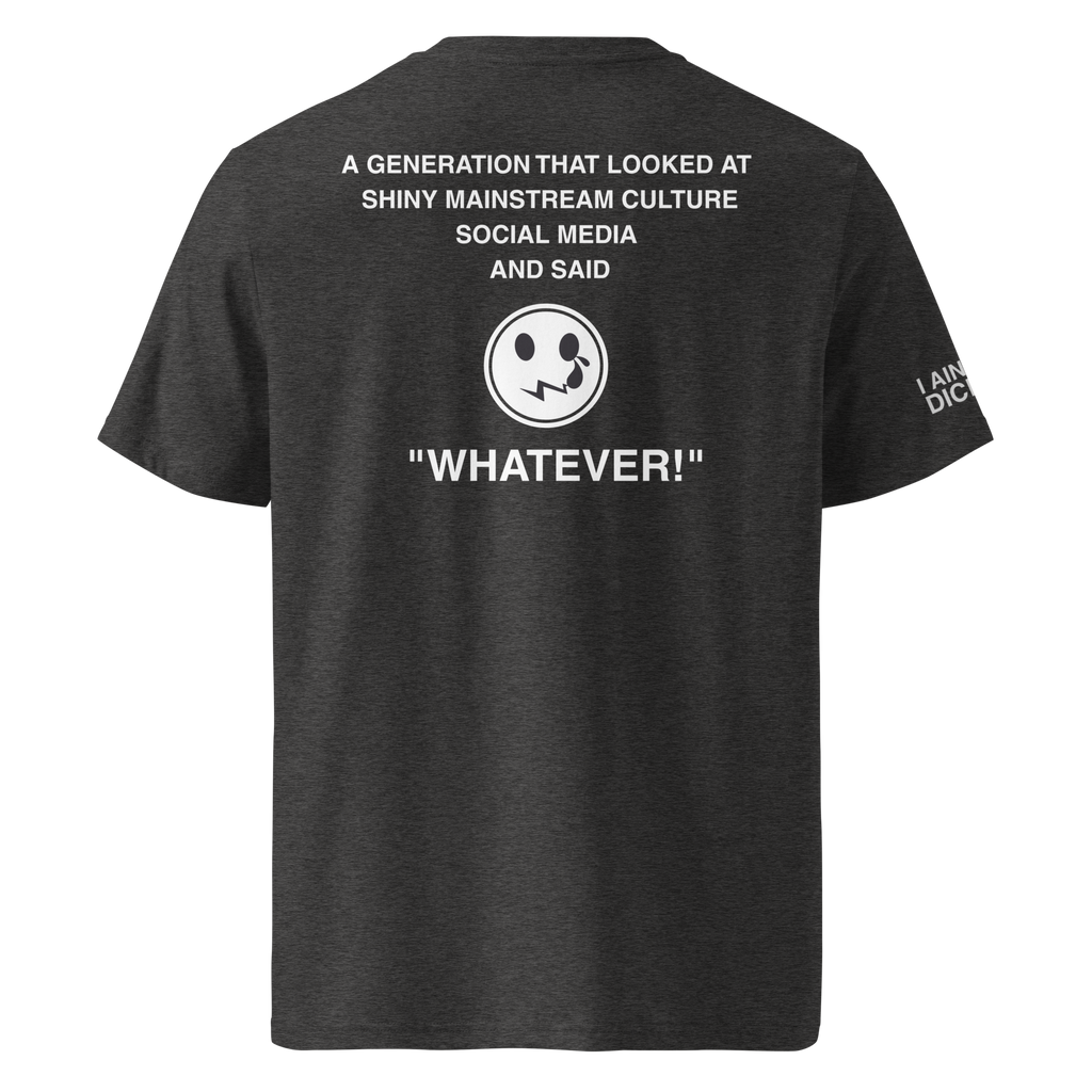 A dark heather gray t-shirt shown from the back, featuring a white graphic print with text and a smiley face with a wide grin. The text reads: 'A GENERATION THAT LOOKED AT SHINY MAINSTREAM CULTURE SOCIAL MEDIA AND SAID "WHATEVER!"'.