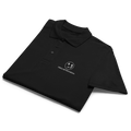 A neatly folded polo shirt featuring a crisp white design with a bold logo prominently displayed on the front. The fabric is soft to the touch, and the shirt's classic silhouette adds a touch of timeless style. 